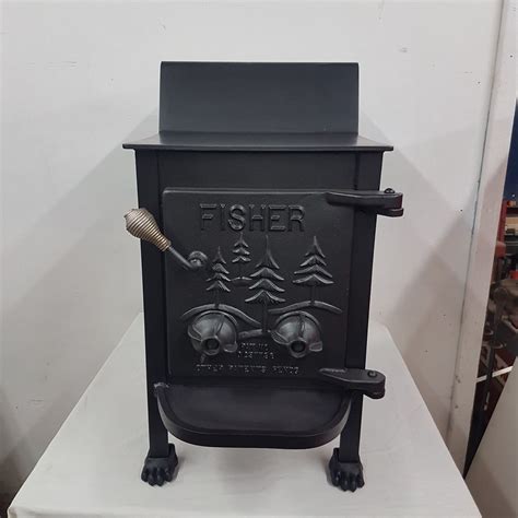If you want to find out more about Fisher Stoves you could try this thread on the hearth. . Fisher grandpa bear wood stove for sale